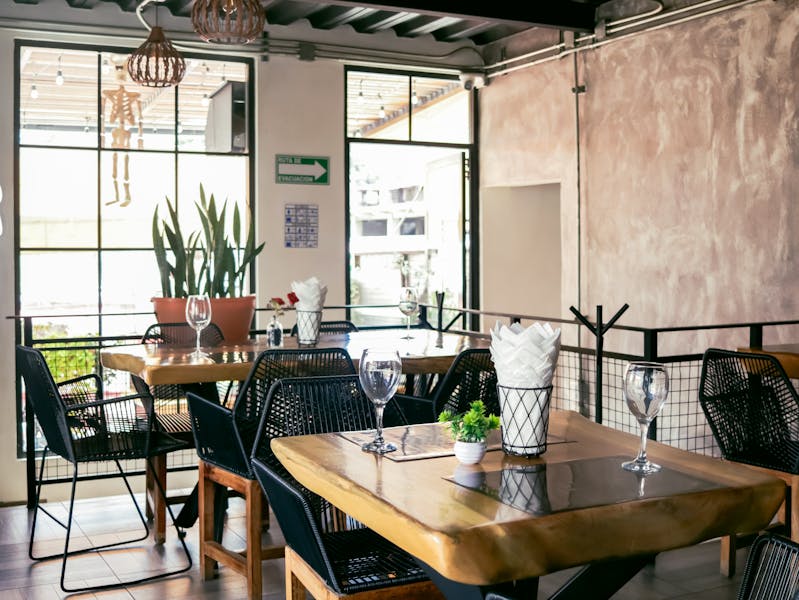 Cafe Rio team members working together in a vibrant restaurant environment